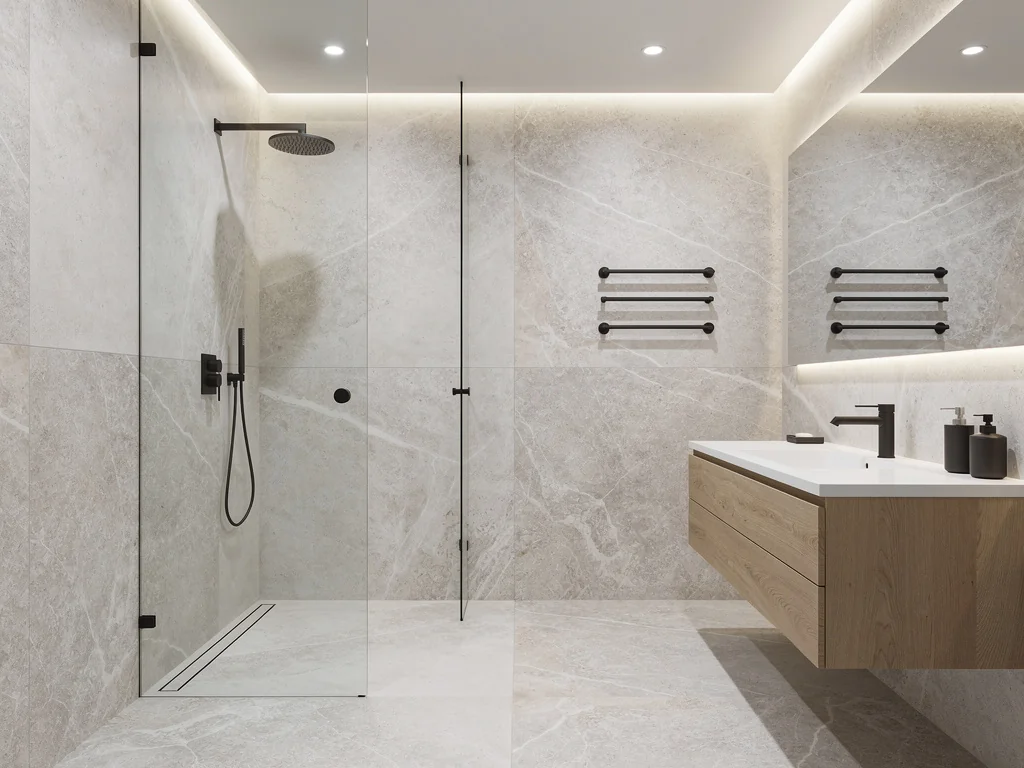 Salle de bain refaite avec douche à l'italienne et carrelage effet pierre au sol